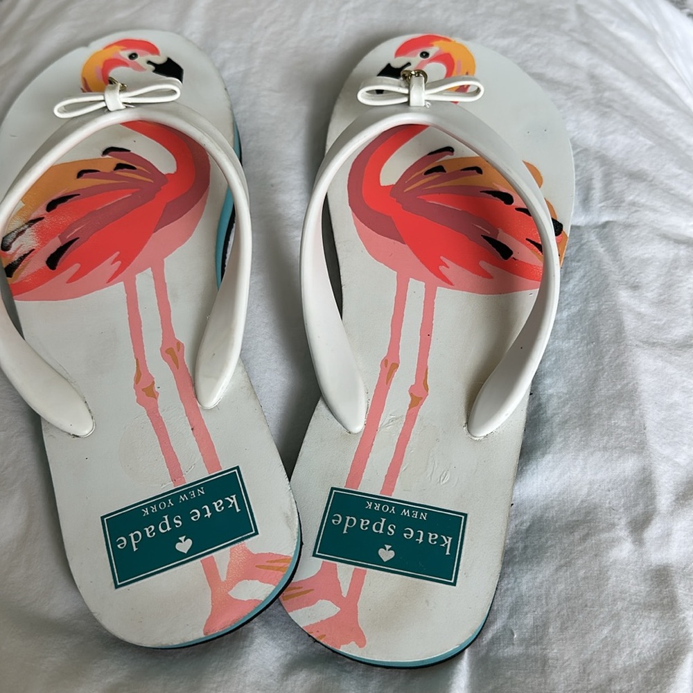 Kate Spade White and Pink Flamingo flip flops sz 7-8 or M. Like new spade charm